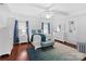 Spacious main bedroom with a tray ceiling, hardwood floors, and stylish decor at 4500 Carrington Dr, Lancaster, SC 29720