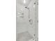 Tiled shower with glass door, rainfall shower head, and niche at 4712 Avalon Forest Ln, Charlotte, NC 28269