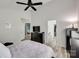 Bedroom showing vaulted ceiling, doorway, walk-in closet and dark wood dresser at 4712 Avalon Forest Ln, Charlotte, NC 28269