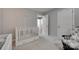Bright Bedroom featuring a crib, rocking chair, and neutral decor, perfect for a calming atmosphere at 4712 Avalon Forest Ln, Charlotte, NC 28269