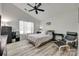 Bedroom with vaulted ceiling, a ceiling fan, and a wooden bed frame on wood-look flooring at 4712 Avalon Forest Ln, Charlotte, NC 28269
