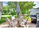 Outdoor patio with comfortable seating, perfect for enjoying the backyard and grilling at 4712 Avalon Forest Ln, Charlotte, NC 28269