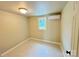 Bright bedroom features air conditioner, neutral walls, and a window providing natural light at 502 E Main St, Cleveland, NC 27013