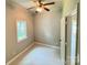Bright bedroom features a ceiling fan, neutral walls, and a window providing natural light at 502 E Main St, Cleveland, NC 27013