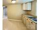 Kitchen with double sinks and shaker style cabinets at 502 E Main St, Cleveland, NC 27013