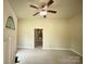 Bright living room featuring new flooring, ceiling fan and neutral paint at 502 E Main St, Cleveland, NC 27013