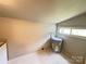Utility room features a newer water heater and a window providing natural light at 502 E Main St, Cleveland, NC 27013