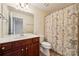 Bathroom featuring a vanity, toilet, and shower with a decorative shower curtain at 5046 Cressingham Dr, Fort Mill, SC 29707