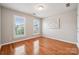 Bright bedroom with natural light from two windows and hardwood floors at 5046 Cressingham Dr, Fort Mill, SC 29707