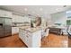 Spacious kitchen featuring a large island, modern appliances, and an open concept design at 5046 Cressingham Dr, Fort Mill, SC 29707