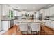Bright kitchen with stainless steel appliances, a large island and modern fixtures at 5046 Cressingham Dr, Fort Mill, SC 29707