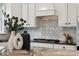 Kitchen area featuring granite countertops, a tile backsplash and modern appliances, showcasing a blend of style and functionality at 5046 Cressingham Dr, Fort Mill, SC 29707
