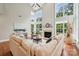 Comfortable living room features lots of natural light, a fireplace and hardwood floors at 5046 Cressingham Dr, Fort Mill, SC 29707