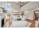 Spacious open-plan living area with fireplace, hardwood floors, and seamless flow to the kitchen at 5046 Cressingham Dr, Fort Mill, SC 29707