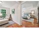 Spacious main bedroom with a sitting area, hardwood floors, and a tray ceiling, offering a luxurious and comfortable retreat at 5046 Cressingham Dr, Fort Mill, SC 29707