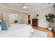 Spacious main bedroom with a ceiling fan, walk-in closet, and a door to the main bath at 5046 Cressingham Dr, Fort Mill, SC 29707