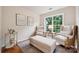 Cozy sitting area with two armchairs, an ottoman, and natural light, creating a peaceful and relaxing space at 5046 Cressingham Dr, Fort Mill, SC 29707