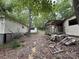 Exterior shows two buildings, a partially covered deck, and debris scattered around the yard at 509 Waring Ct # Lot 4, Fort Mill, SC 29707