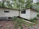 Exterior shows the side of the home with tan siding and dark green foliage at 509 Waring Ct # Lot 4, Fort Mill, SC 29707