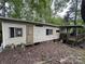 Shows exterior features and weathered facade including a small porch and stairs at 509 Waring Ct # Lot 4, Fort Mill, SC 29707