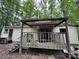 A partially covered porch is seen on the exterior of the home with tan siding at 509 Waring Ct # Lot 4, Fort Mill, SC 29707