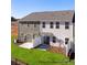 Townhome backyards with patios and green grass, perfect for relaxing and enjoying outdoor living at 5142 Tommy Ln # 1202, Stanley, NC 28164