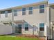 Townhome backyard with a patio and green grass, perfect for relaxing and enjoying outdoor living at 5142 Tommy Ln # 1202, Stanley, NC 28164