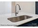 Close-up of a stainless steel sink in a kitchen island with a modern faucet and sleek countertop at 5142 Tommy Ln # 1202, Stanley, NC 28164