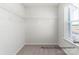 A walk-in closet with a wire rack shelving system and neutral carpeting for ample storage at 5142 Tommy Ln # 1202, Stanley, NC 28164