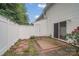 Enclosed back patio space with white fence and sliding glass doors leading into the home at 5237 Ficus Tree Ln, Charlotte, NC 28215