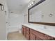 Bright bathroom features double sinks, vanity, and a shower-tub combination at 5237 Ficus Tree Ln, Charlotte, NC 28215
