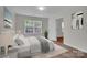 Cozy bedroom with a large window, soft natural light, and neutral decor at 5237 Ficus Tree Ln, Charlotte, NC 28215