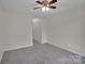 Neutral bedroom featuring carpet flooring, ceiling fan, and neutral wall colors at 5237 Ficus Tree Ln, Charlotte, NC 28215
