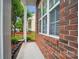 Brick exterior of home with large windows and view of the front yard at 5237 Ficus Tree Ln, Charlotte, NC 28215