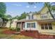 Charming two-story home with blue shutters, well-manicured lawn, and inviting entryway at 5237 Ficus Tree Ln, Charlotte, NC 28215