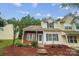 Charming townhouse with brick accents, blue shutters, and a well-maintained front yard landscape at 5237 Ficus Tree Ln, Charlotte, NC 28215