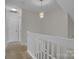 Upstairs hallway with access to multiple rooms and stairwell at 5237 Ficus Tree Ln, Charlotte, NC 28215