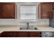 Well-lit kitchen features a stainless steel sink and a bright window at 5237 Ficus Tree Ln, Charlotte, NC 28215