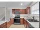 Updated kitchen with stainless steel appliances and updated cabinets at 5237 Ficus Tree Ln, Charlotte, NC 28215