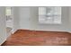 The Living room features wood floors, a large window and front door at 5237 Ficus Tree Ln, Charlotte, NC 28215