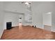 Spacious living room with fireplace and staircase at 5237 Ficus Tree Ln, Charlotte, NC 28215
