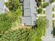 An aerial view shows this grey roofed townhome community, set amongst lush greenery and mature trees at 5305 Waverly Lynn Ln # 4A, Charlotte, NC 28269