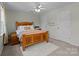 Cozy bedroom with a plush rug, closet, and light-colored walls offers a serene and comfortable retreat at 5305 Waverly Lynn Ln # 4A, Charlotte, NC 28269