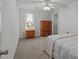 Bedroom with carpet, ceiling fan, and wood furniture creating a comfortable and inviting atmosphere at 5305 Waverly Lynn Ln # 4A, Charlotte, NC 28269