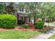 Beautiful townhome with lush landscaping, mature trees, and well-kept lawn and charming curb appeal at 5305 Waverly Lynn Ln # 4A, Charlotte, NC 28269