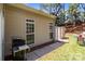 Side view of the home featuring a grill and easy access to the fenced patio and backyard at 5305 Waverly Lynn Ln # 4A, Charlotte, NC 28269