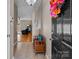 Inviting foyer with tile flooring, a bench, and a view into the living area at 5305 Waverly Lynn Ln # 4A, Charlotte, NC 28269