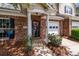 Welcoming front entrance with brick accents, a charming wreath, and a well-maintained facade at 5305 Waverly Lynn Ln # 4A, Charlotte, NC 28269
