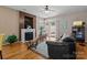 Comfortable living room featuring a fireplace and access to the backyard at 5305 Waverly Lynn Ln # 4A, Charlotte, NC 28269