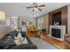 Spacious living room with a fireplace, hardwood floors, and a view of the dining area at 5305 Waverly Lynn Ln # 4A, Charlotte, NC 28269